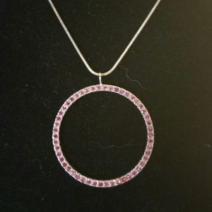 SS .925 round pendant pink sapphire stones on a Silver Chain.